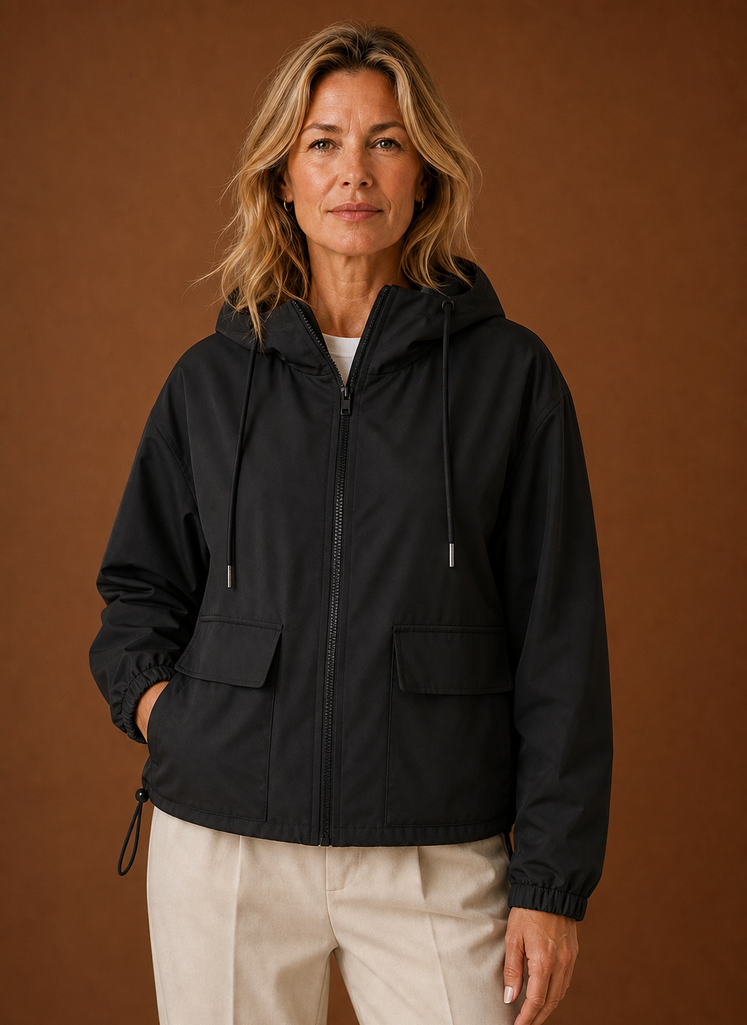 Lightweight hooded windbreaker jacket for women, perfect for versatile outdoor wear, featuring a stylish design and breathable fabric ideal for various weather conditions. 0