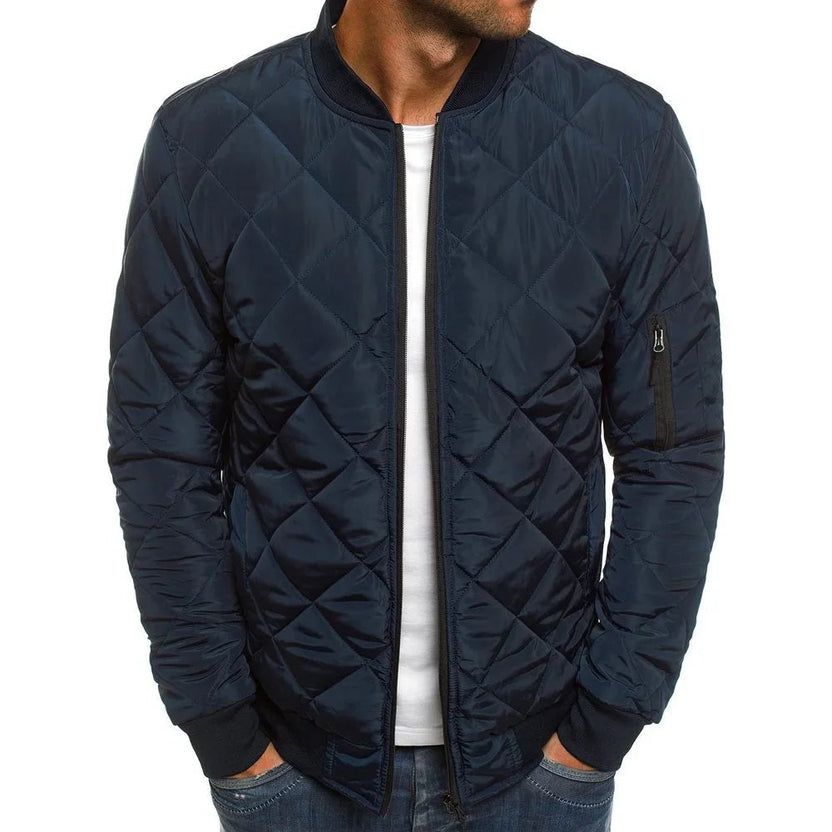Men's quilted bomber jacket featuring ribbed trim and a zip pocket, perfect for stylish warmth and functionality. 5