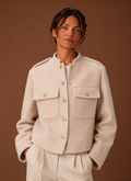 Women's cropped button-front jacket featuring a tailored fit, designed for a stylish and modern look, perfect for layering over casual or formal outfits. 0