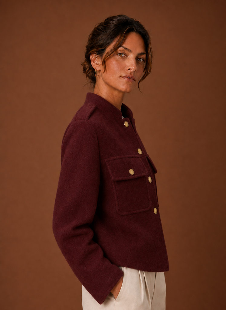 Women's cropped button-front jacket featuring a tailored fit, designed for a stylish and modern look, perfect for layering over casual or formal outfits. 7