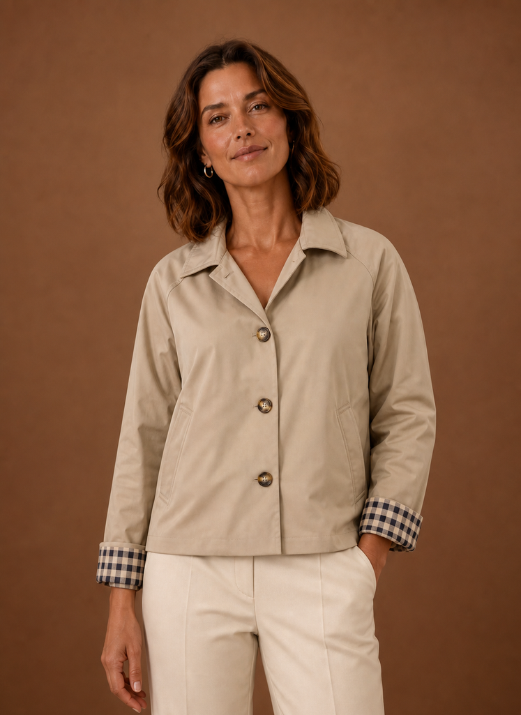 Women's lightweight button-front jacket featuring a relaxed fit, perfect for casual outings or layering in transitional weather. 0