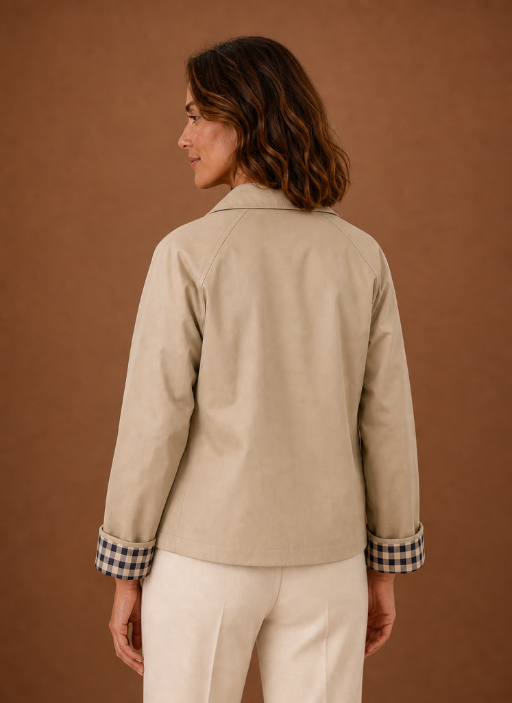 Women's lightweight button-front jacket featuring a relaxed fit, perfect for casual outings or layering in transitional weather. 1