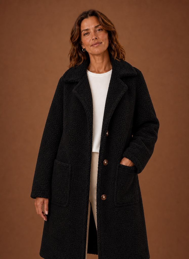 Women's long double-breasted teddy coat in plush fabric, perfect for keeping warm during winter with stylish design and comfortable fit. 4