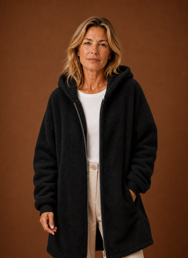 Women's long fleece hooded jacket featuring a zip closure and spacious pockets, perfect for staying warm and stylish in cold weather. 0