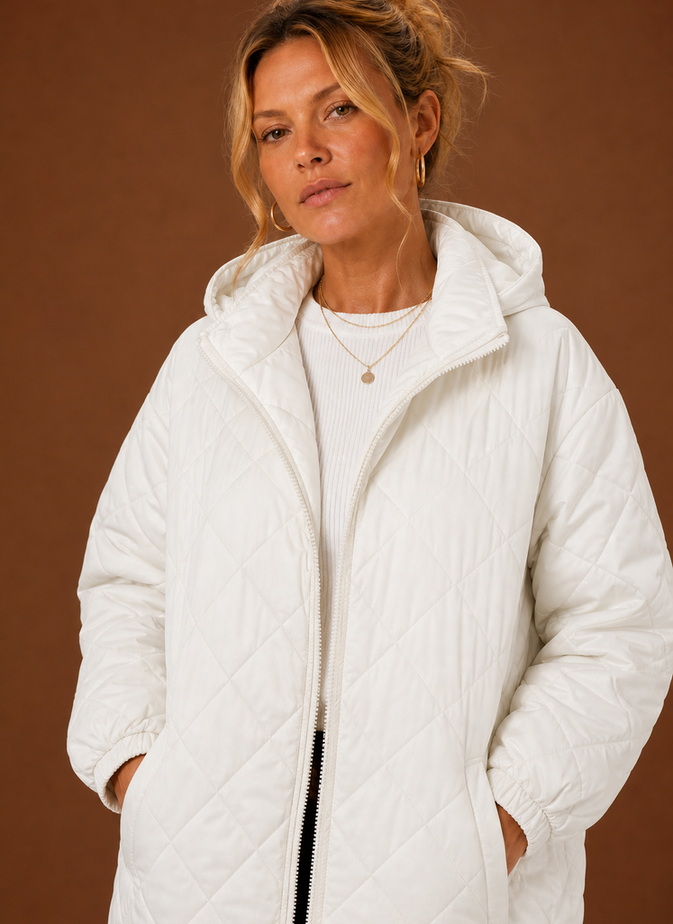 Women's long quilted hooded winter coat featuring a relaxed fit, designed for warmth and comfort during cold weather. 5