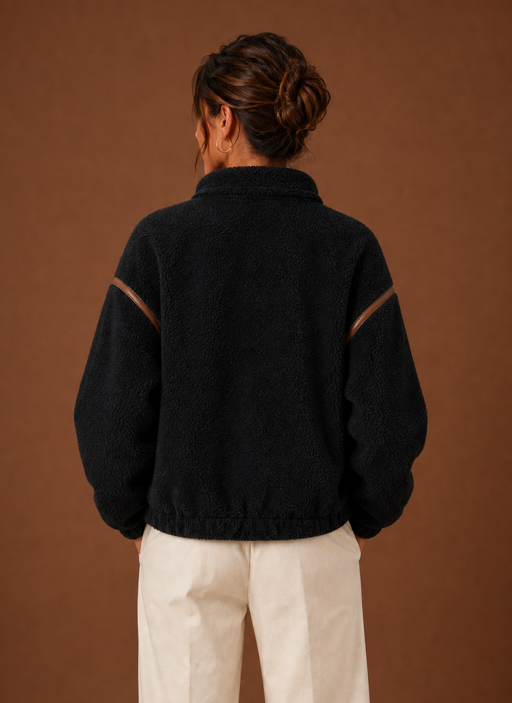 Women's Sherpa zip-up fleece jacket featuring cozy patch pockets, perfect for layering in cold weather. 4