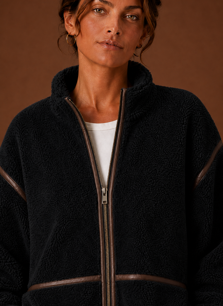 Women's Sherpa zip-up fleece jacket featuring cozy patch pockets, perfect for layering in cold weather. 5