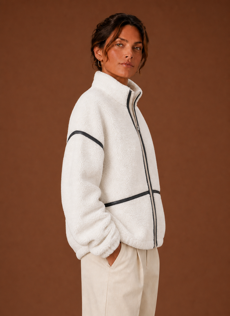 Women's Sherpa zip-up fleece jacket featuring cozy patch pockets, perfect for layering in cold weather. 6