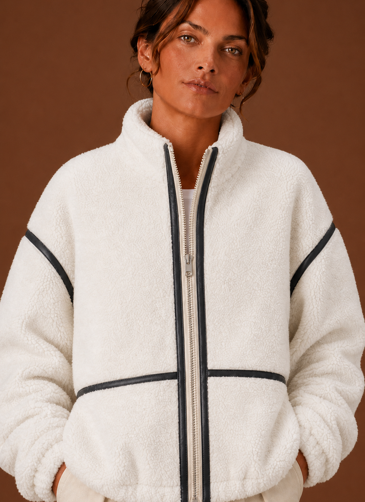 Women's Sherpa zip-up fleece jacket featuring cozy patch pockets, perfect for layering in cold weather. 8