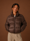 Women's tailored quilted puffer jacket in stylish design, perfect for fall and winter warmth and fashion. 0